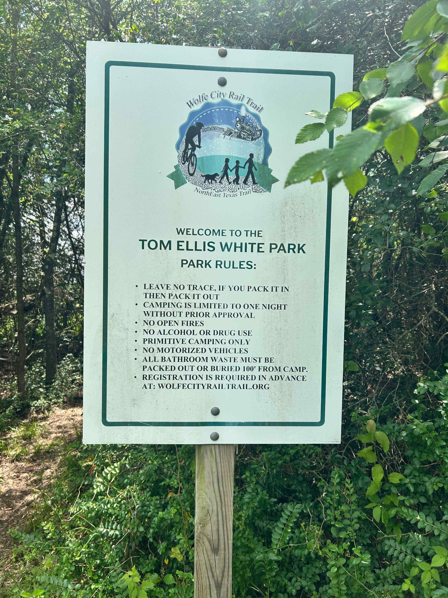 Tom Ellis White Park welcome sign with park rules